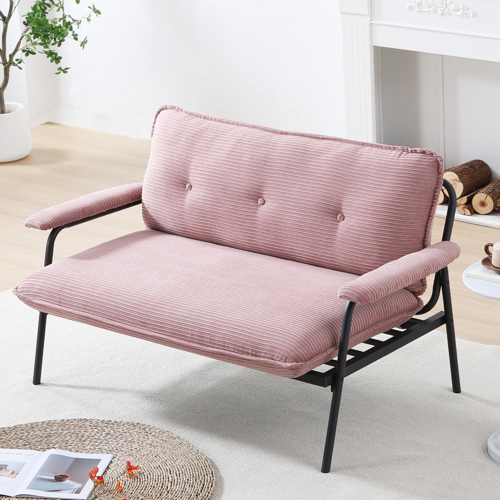 The 53-inch pink sofa offers a spacious layout in the small apartment, easily