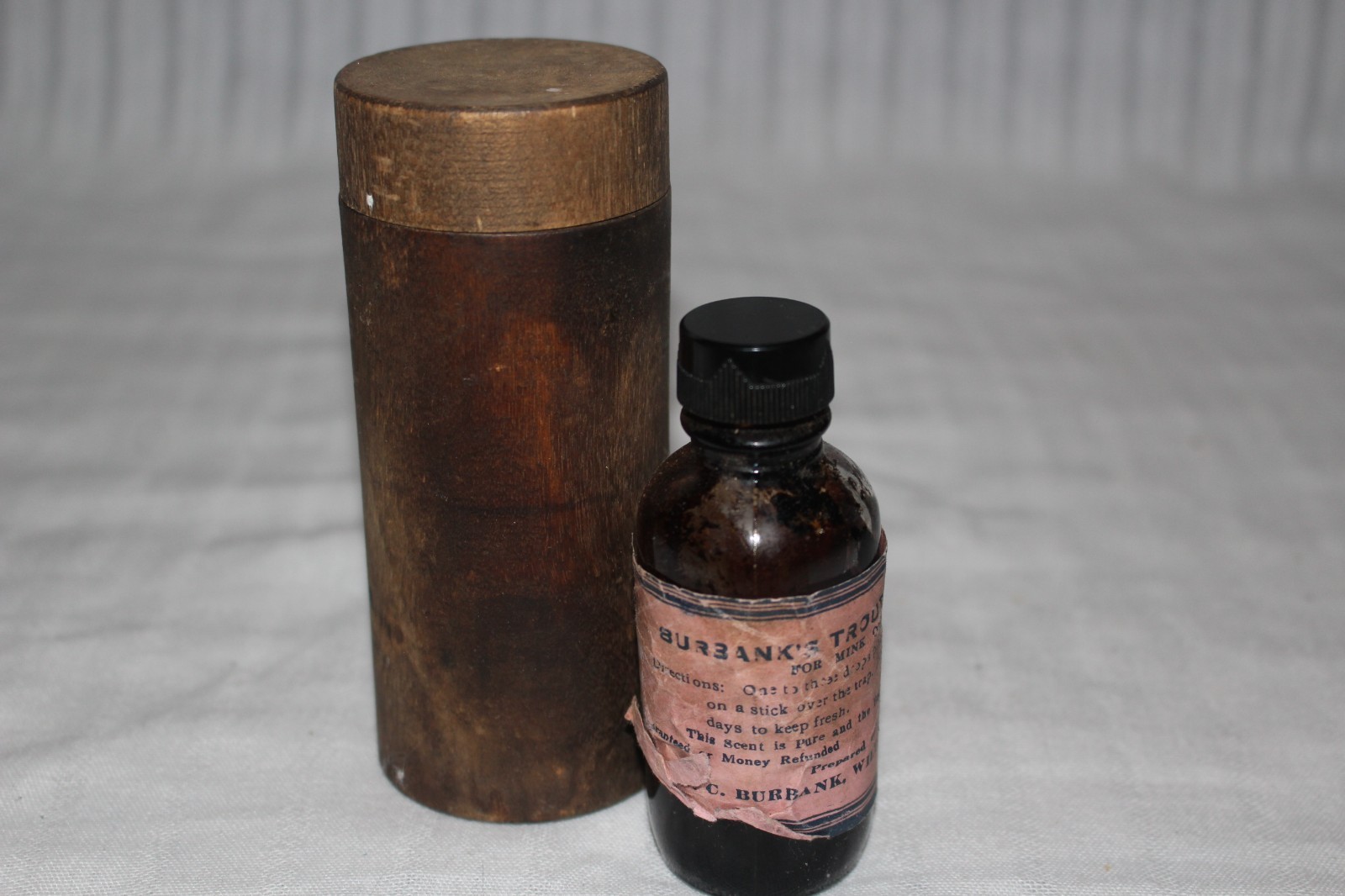 Vintage N.C. Burbank Trout Oil Scent for Mink Bottle w/ Wood Holder Wilton, ME