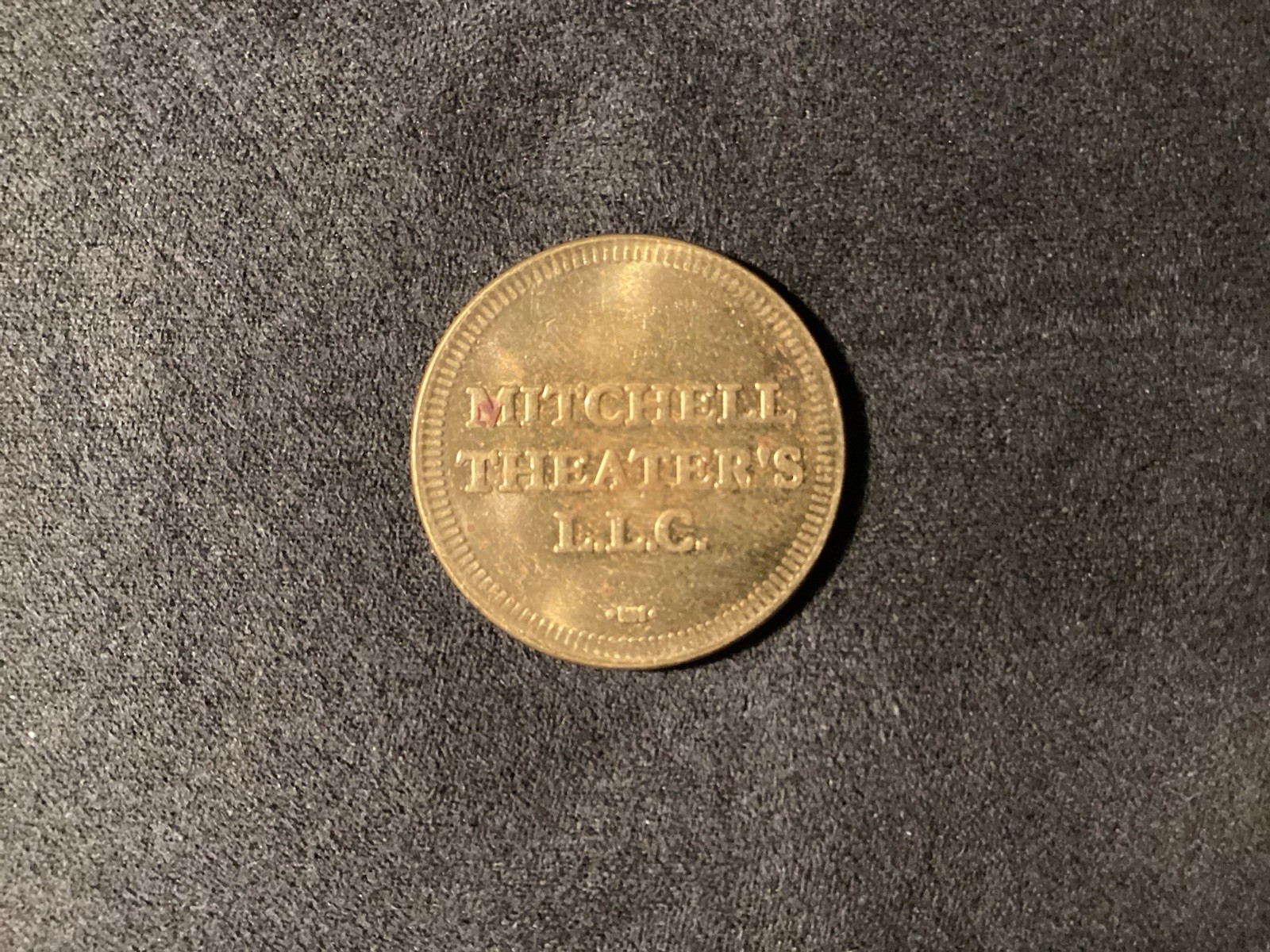 VINTAGE MITCHELL THEATER'S L. L. C. TOKEN