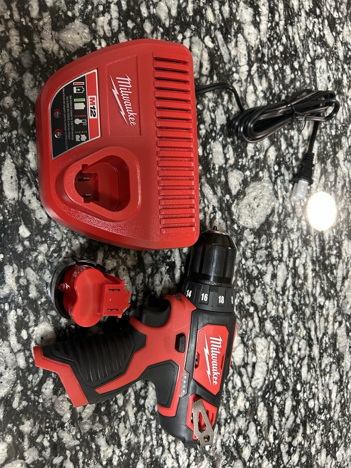 Milwaukee drill, battery, and charger