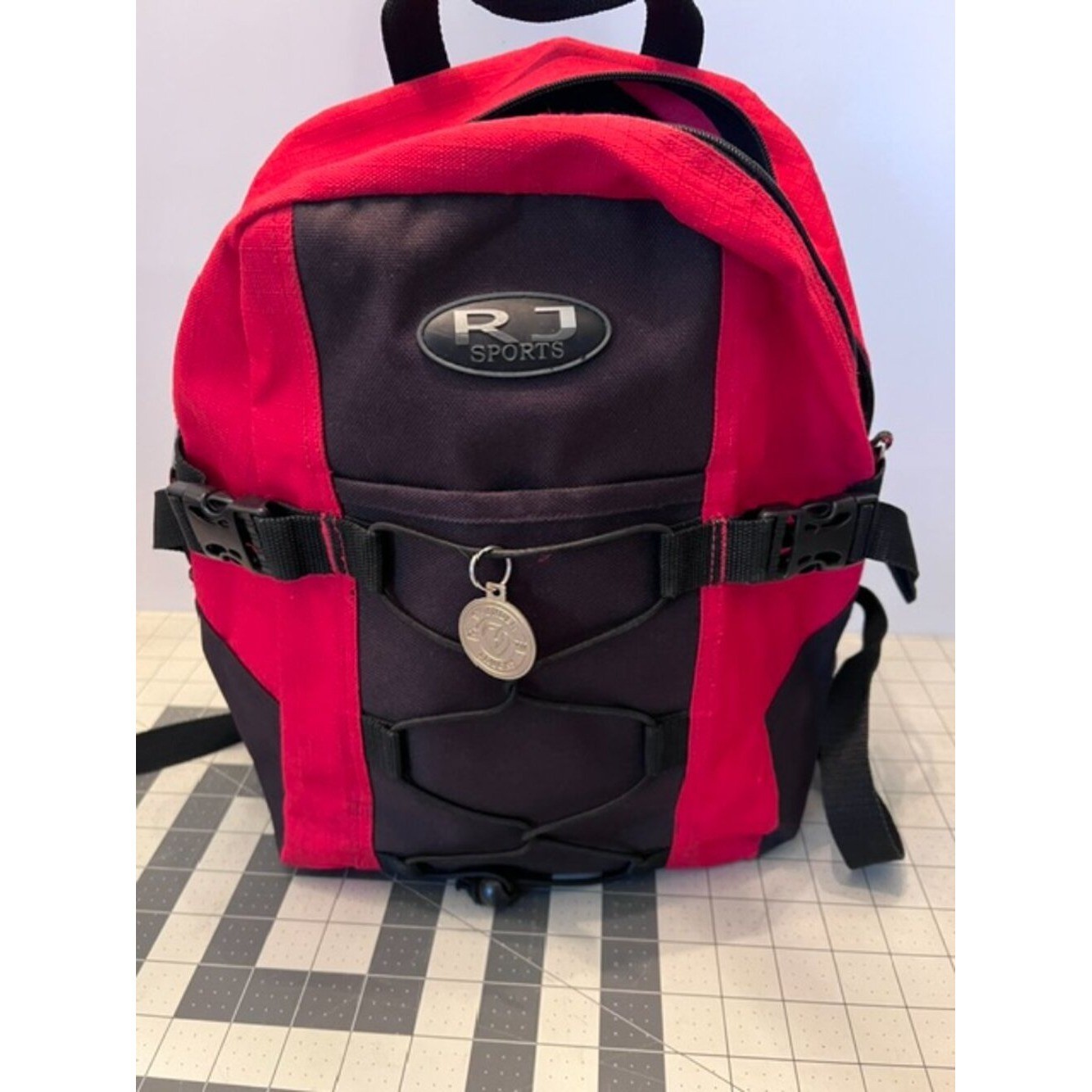 RJ SPORTS Backpack Red & Black athletic school lightweight bungee cord system