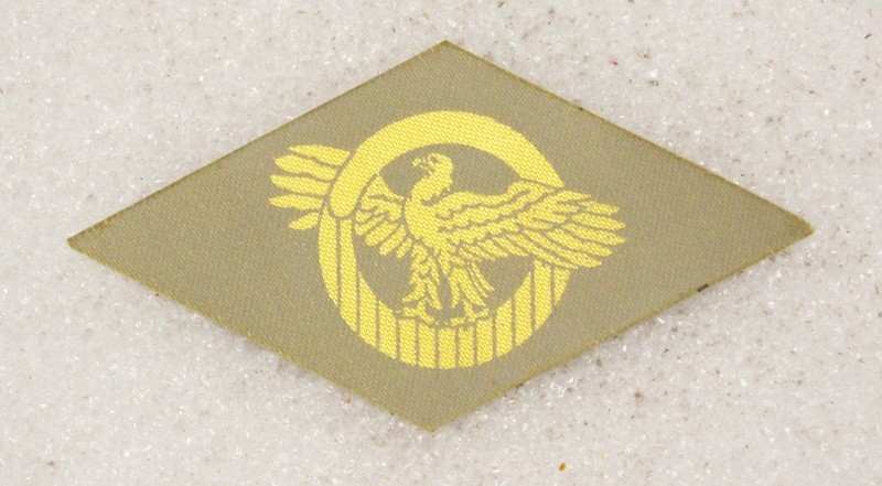 Cloth Army Badge 068: WWII Discharge Diamond, Ruptured Duck - printed on khaki