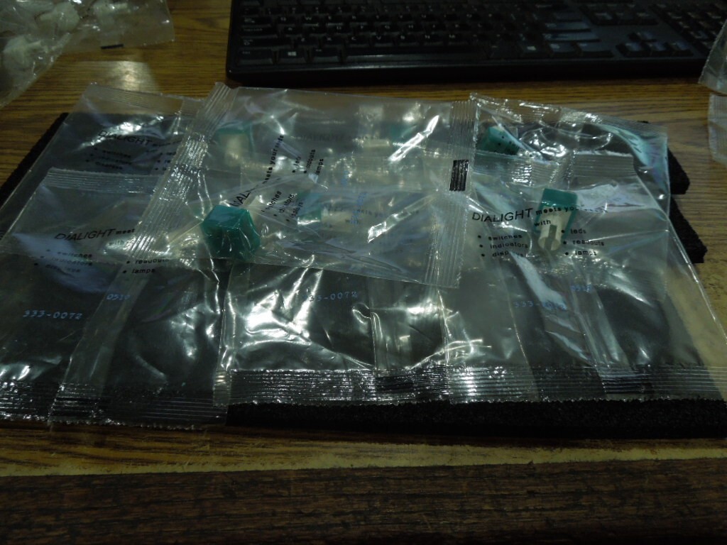 Lot of Dialight P/N:  333-0072 Switch Covers.  Green.  Qty. 7.   New Old Stock