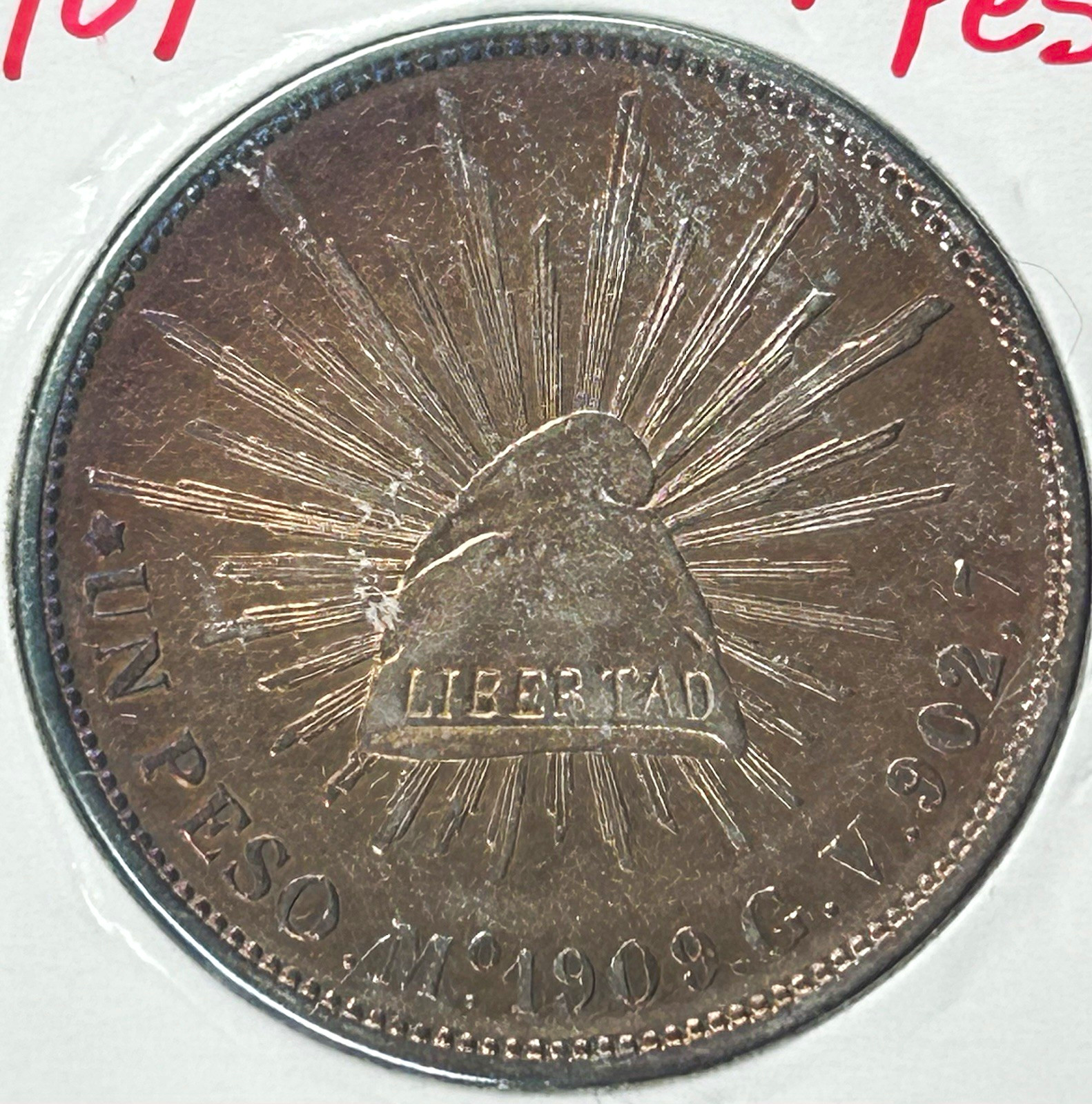 1909 Mo GV 1 Peso Silver Coin KM#409 Toning on Obv - Last Year of Cap&Rays Pesos