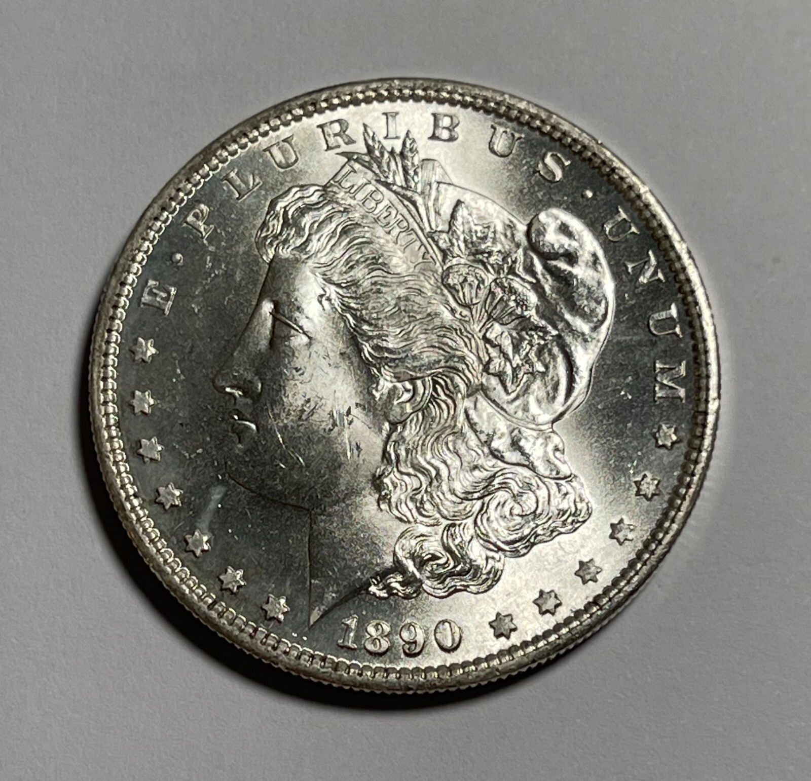 1890-S Morgan dollar (#16676) CH BU flashy minor dark area near edge.