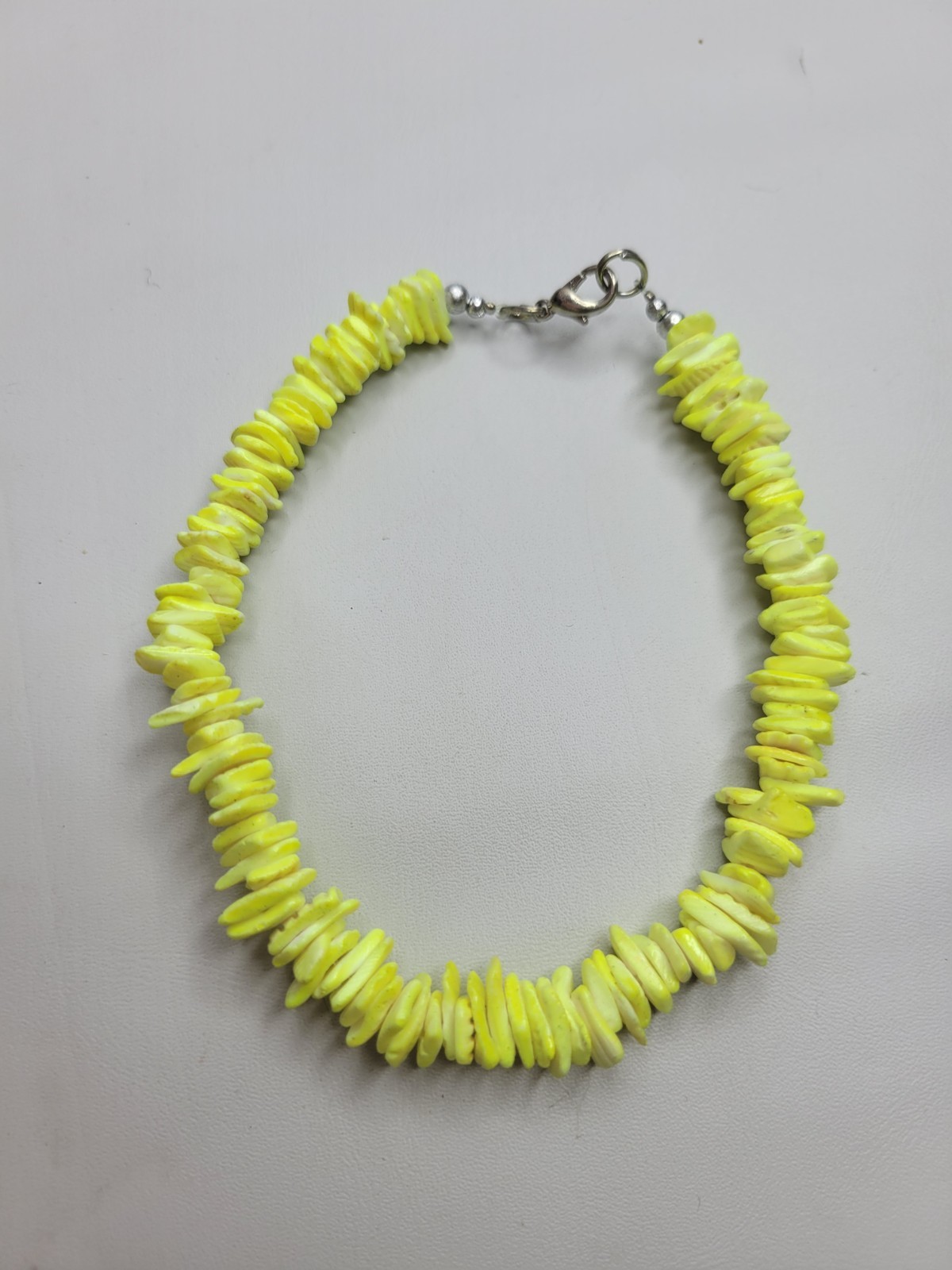 Neon yellow puka chip shell Bracelet with a lobster claw clasp 10" Adjustable