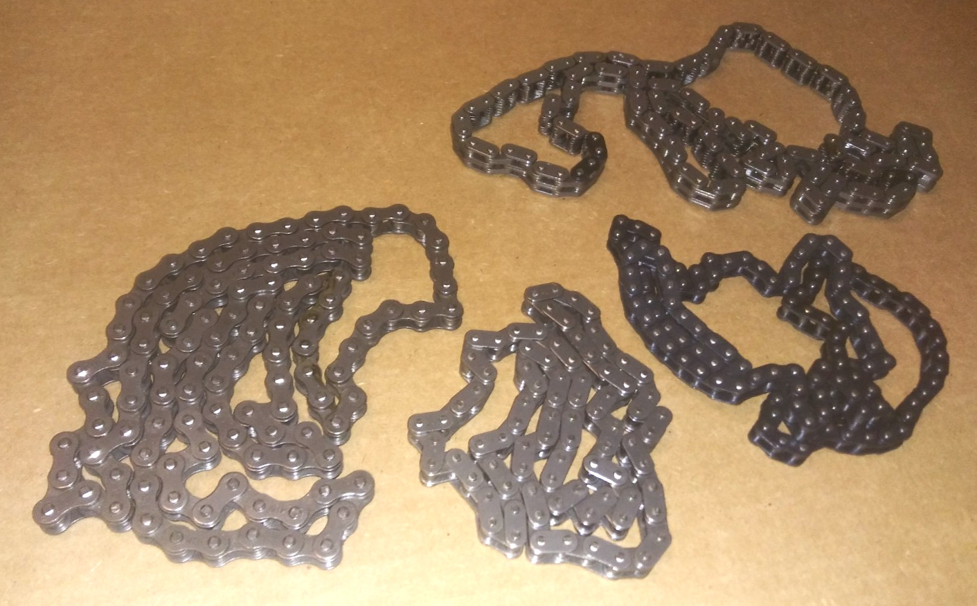 LOT OF 4 BIKE CHAINS, DIFFERENT LENGTHS -ALL NEW