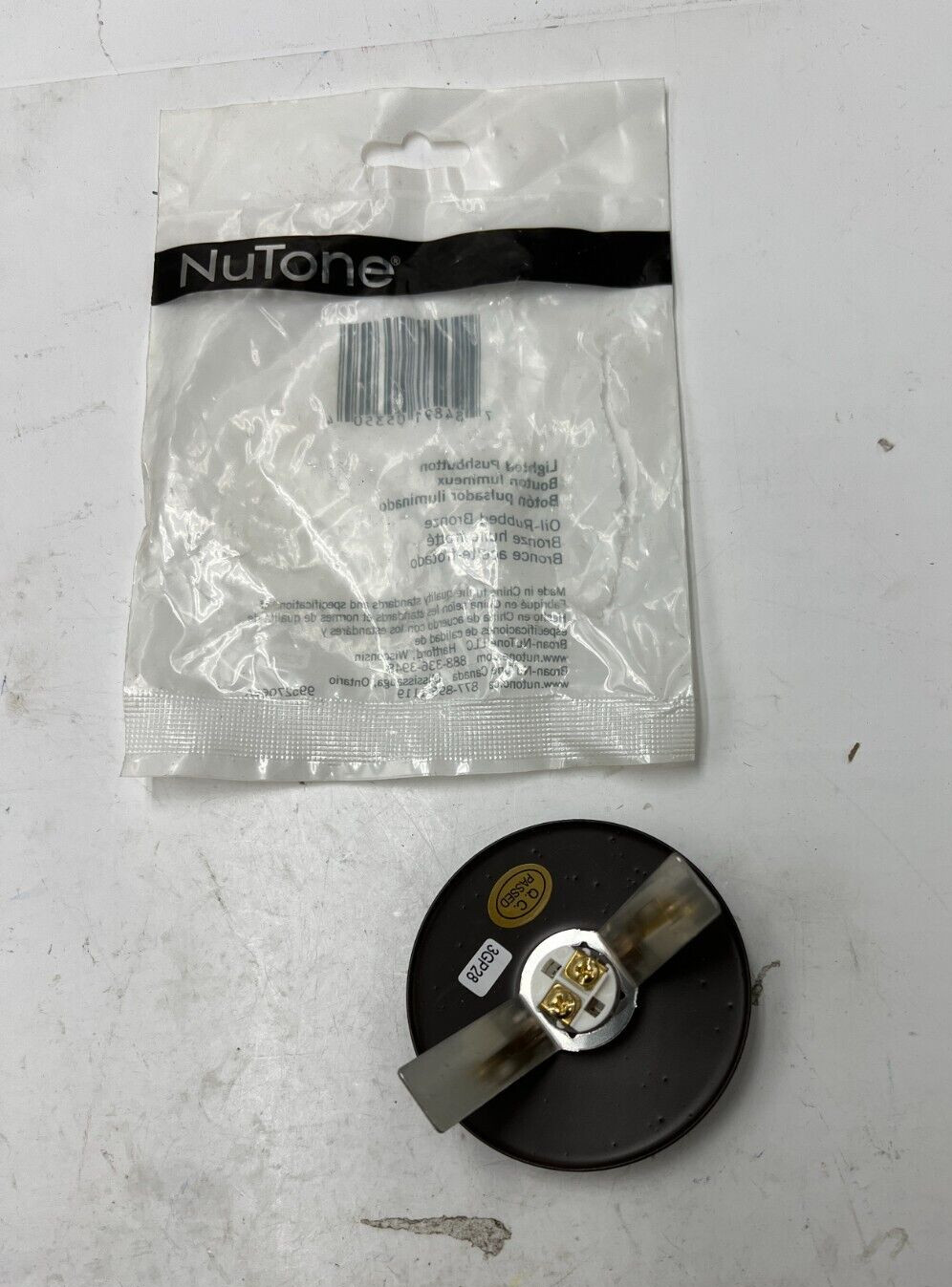 Broan NuTone Oil-Rubbed Bronze Lighted Round Stucco Pushbutton PB41LBR