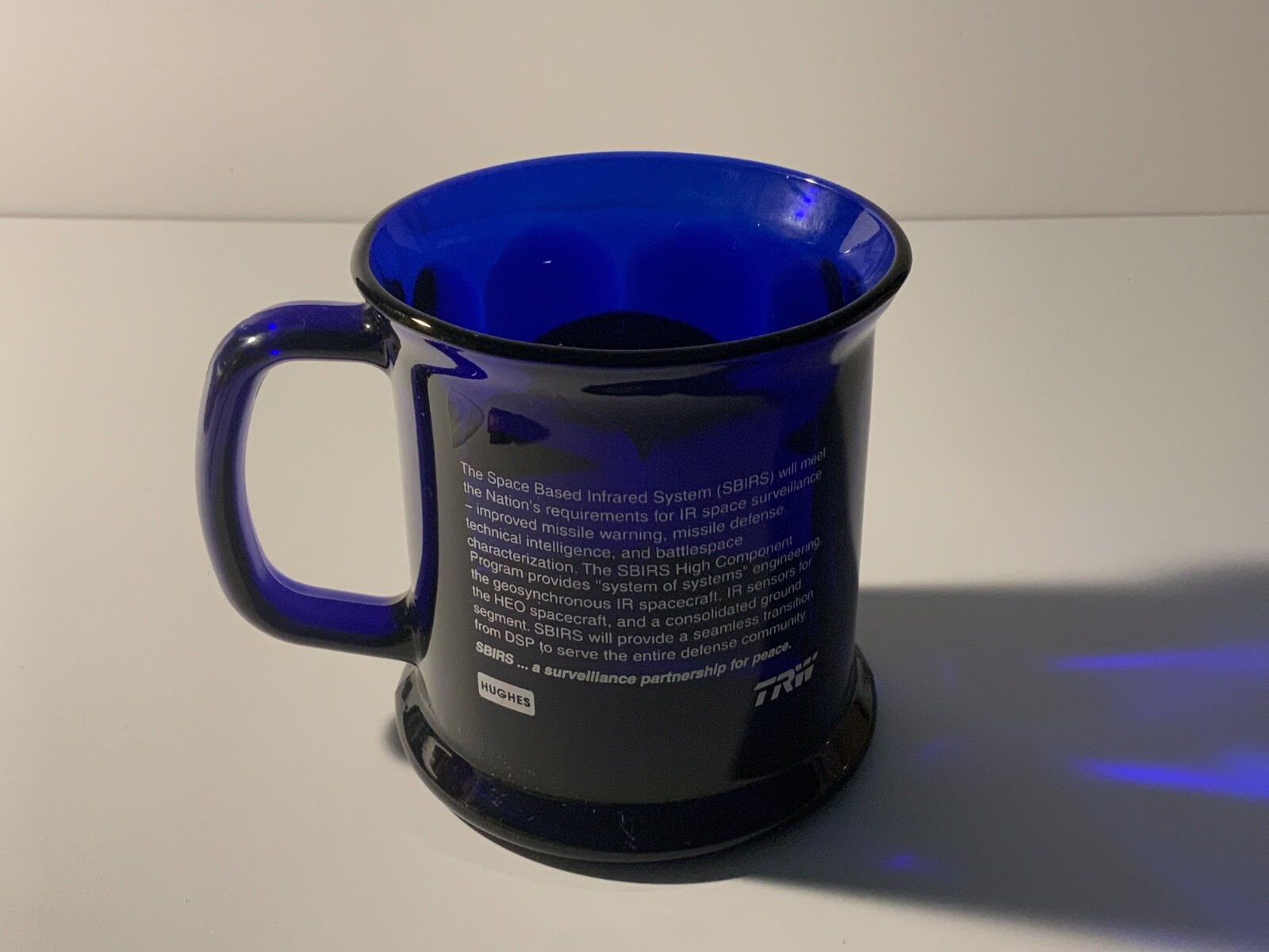TRW SPACE BASED INFRARED SYSTEM MUG. SBIRS HIGH COMPONENT MUG BLUE GLASS