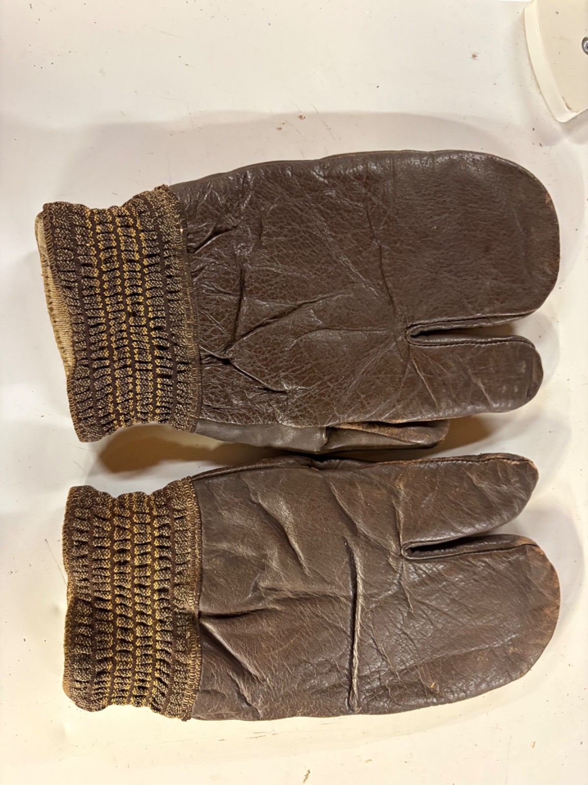 authentic WWII USN US Navy gunner gloves feature brown leather construction