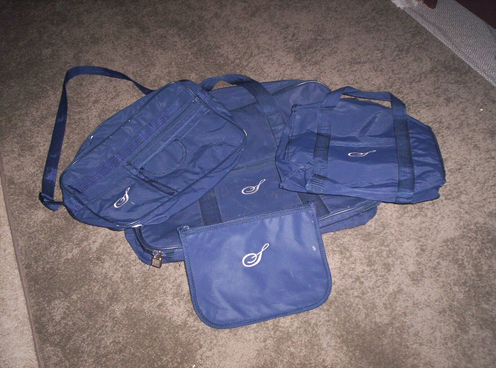 Set 4 Vinyl Travel Bags with Monogram "S" on all four