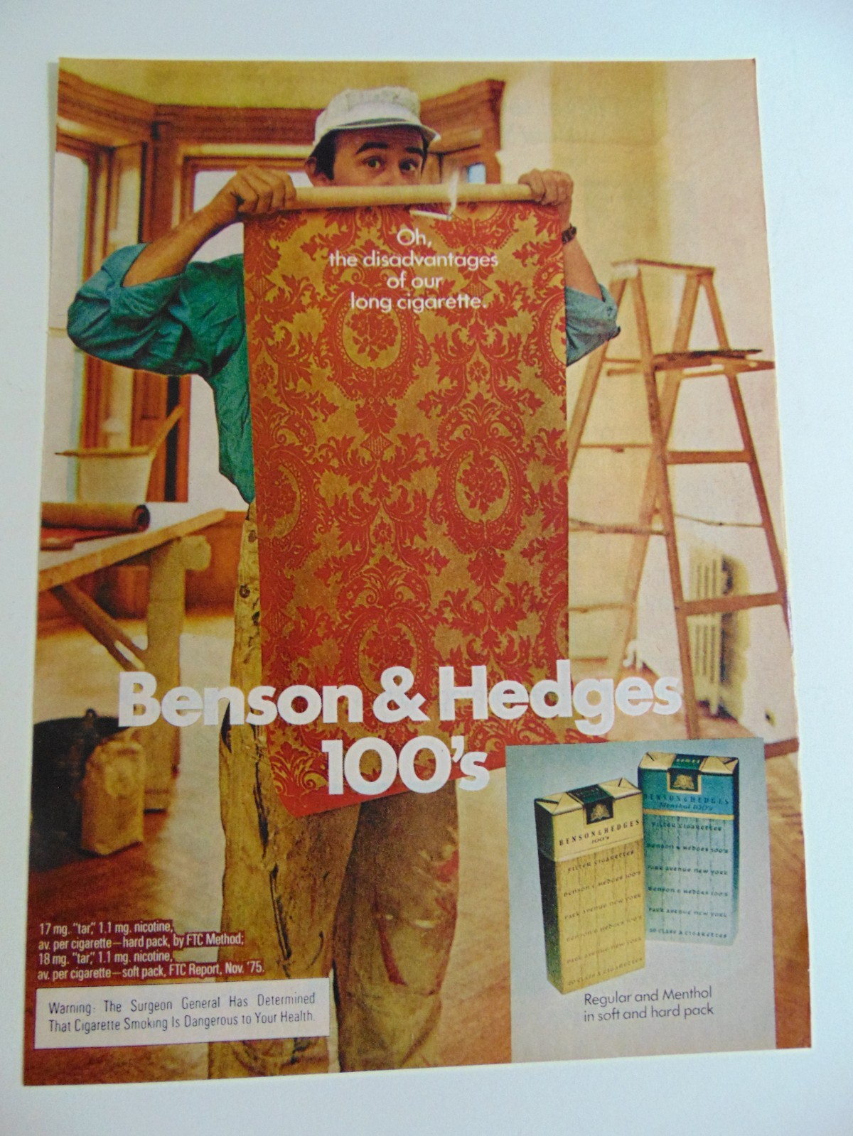 1976 BENSON & HEDGES 100's- Long Cigarette Burns through wallpaper- print ad