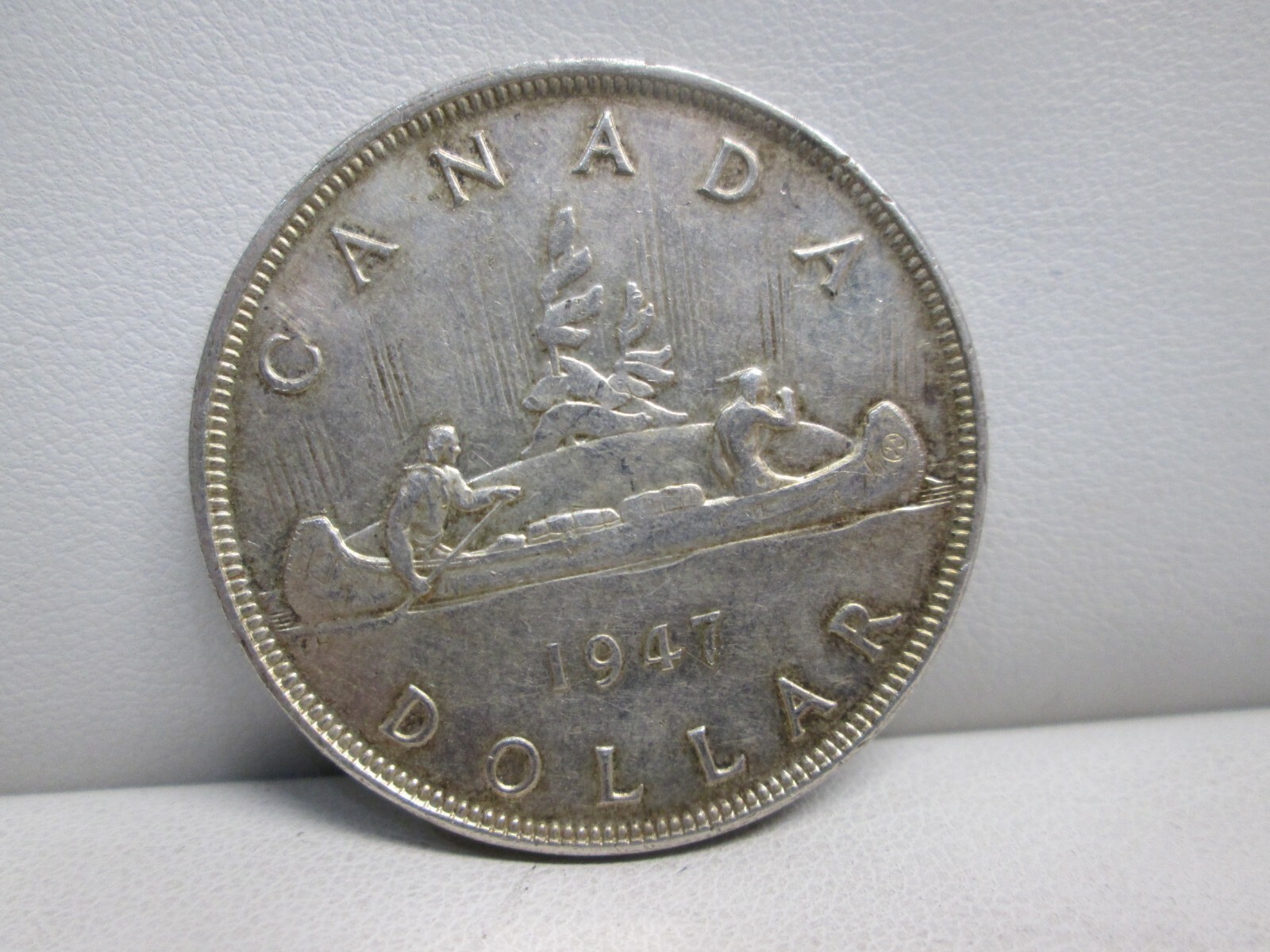 1947 CANADIAN SILVER DOLLAR- HIGHER GRADE- POINTED 7