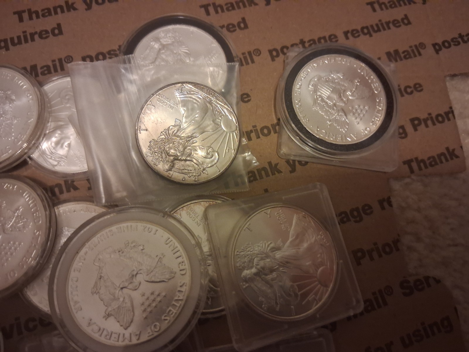 23 US Silver Eagles-- .999 Silver-some toned--see photos