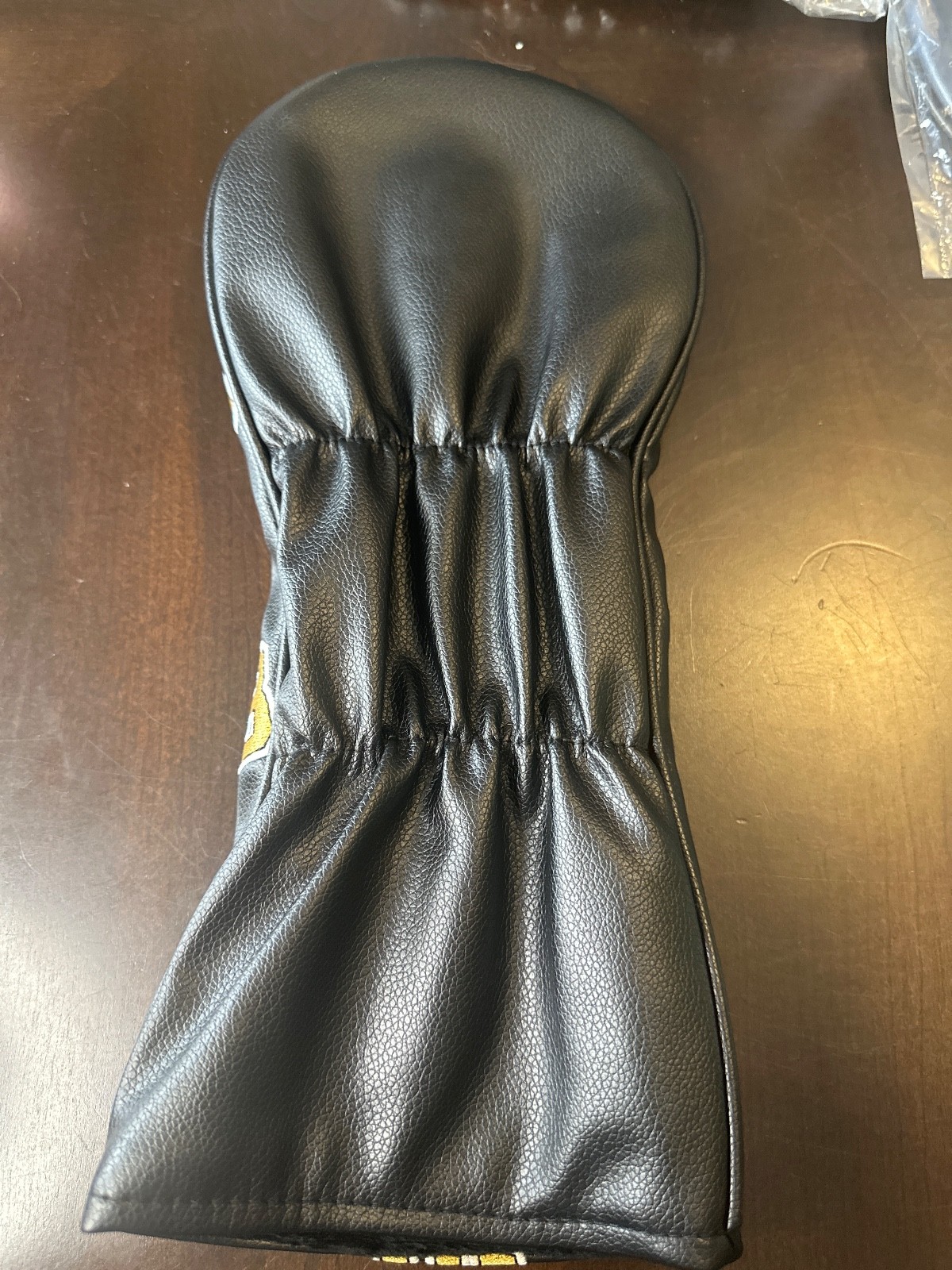 Happy Gilmore 18 driver head cover.