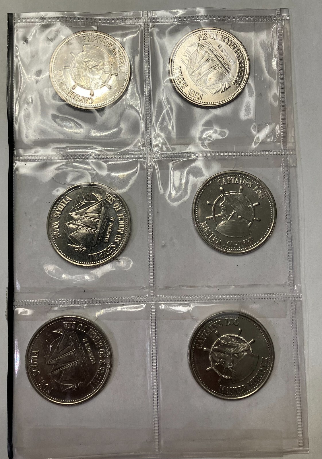 Nova Scotia Bluenose II Coin. Captain`s Log. Master Mariner Medal. EACH