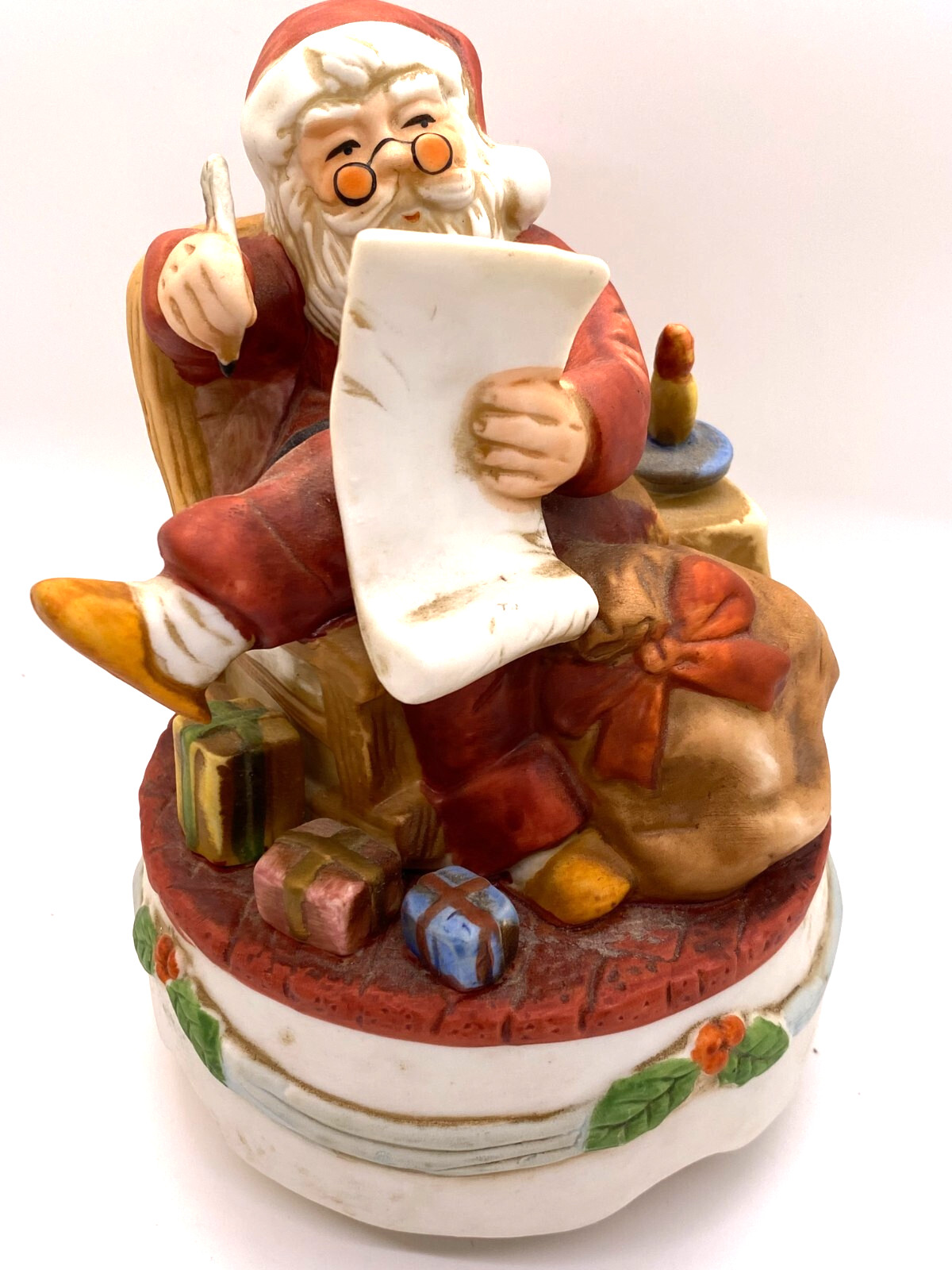 Santa Clause figurine checking his list twice / music box, plays Jingle Bells