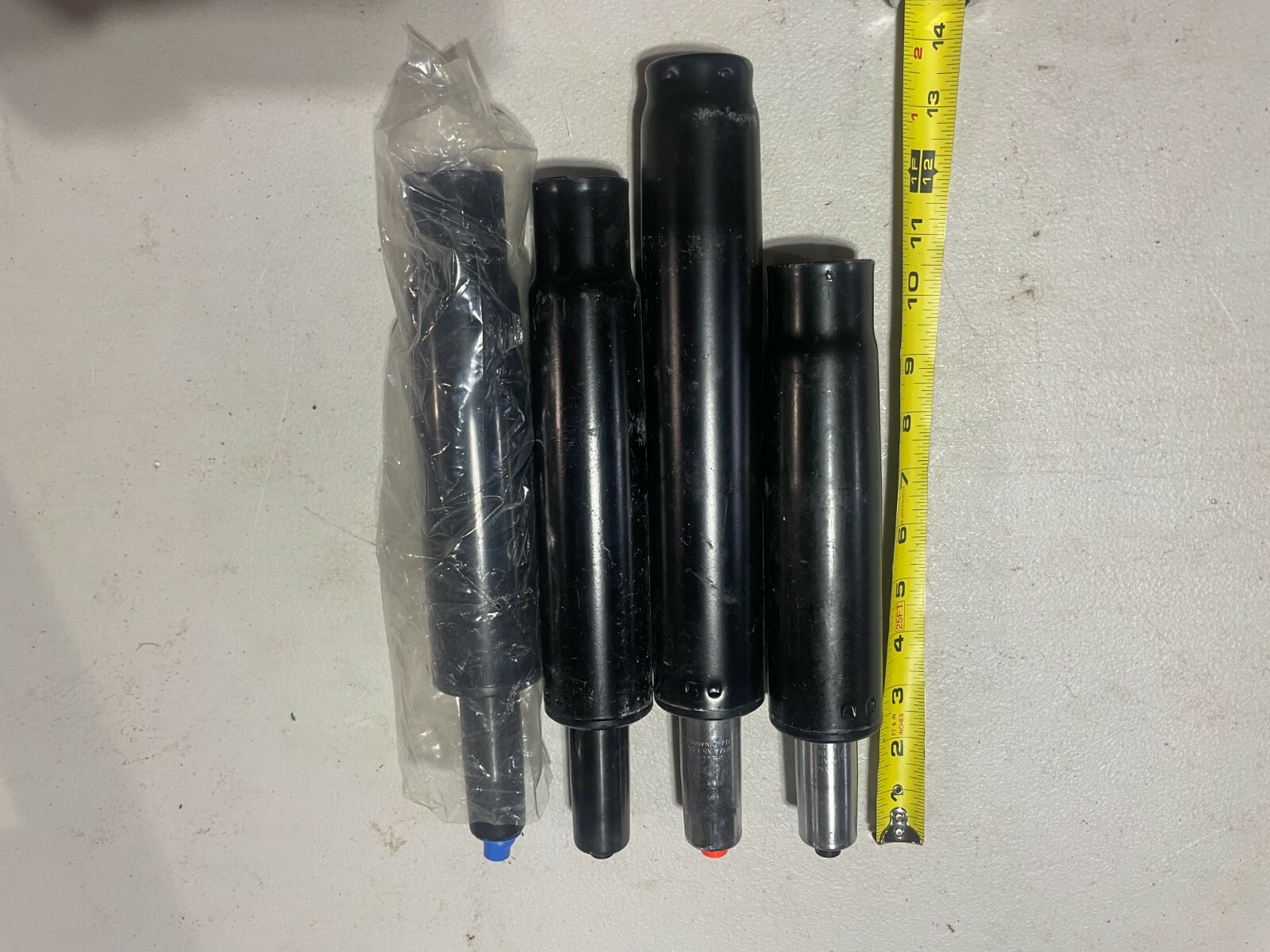 lot of 4 various BIFMA and other Chair Gas Lift Cylinder
