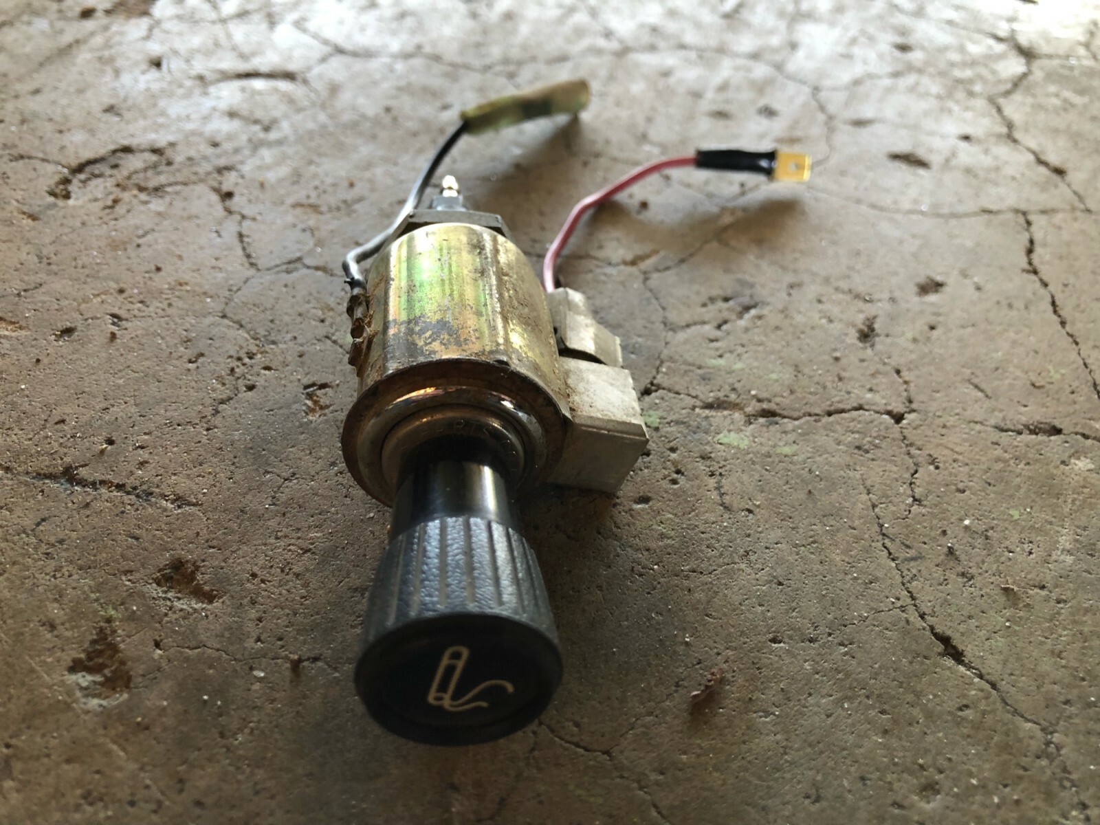 1971-1973 Datsun 240Z cigarette lighter assembly.