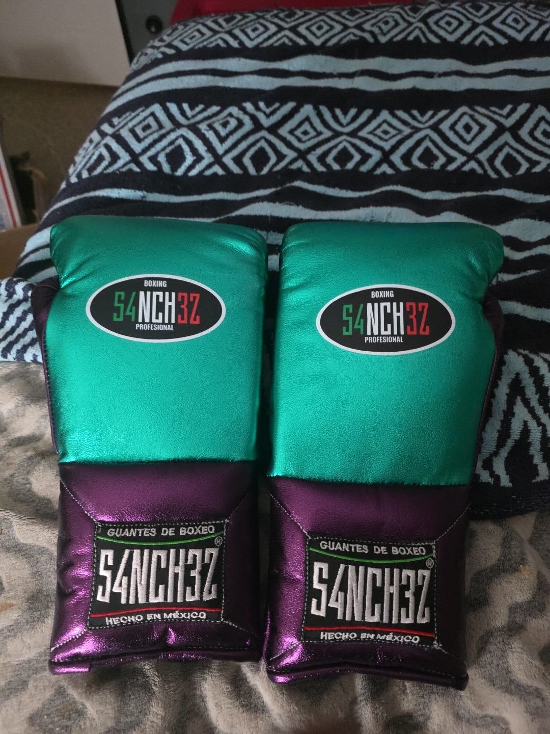 Brand NEW NEVER WORN OR USED. SANCHEZ METALLIC GREEN AND PURPLE BOXING GLOVES.