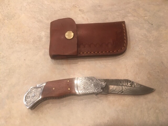Damascus folding blade knife w/burl wood handle, etched bolster & leather case