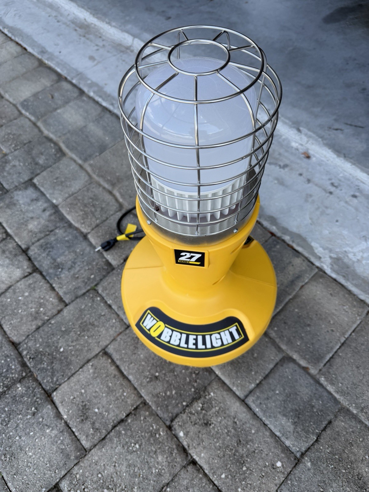 Wobblelight Yellow Corded Portable Worklight 120V w/ Protective Wire Cage