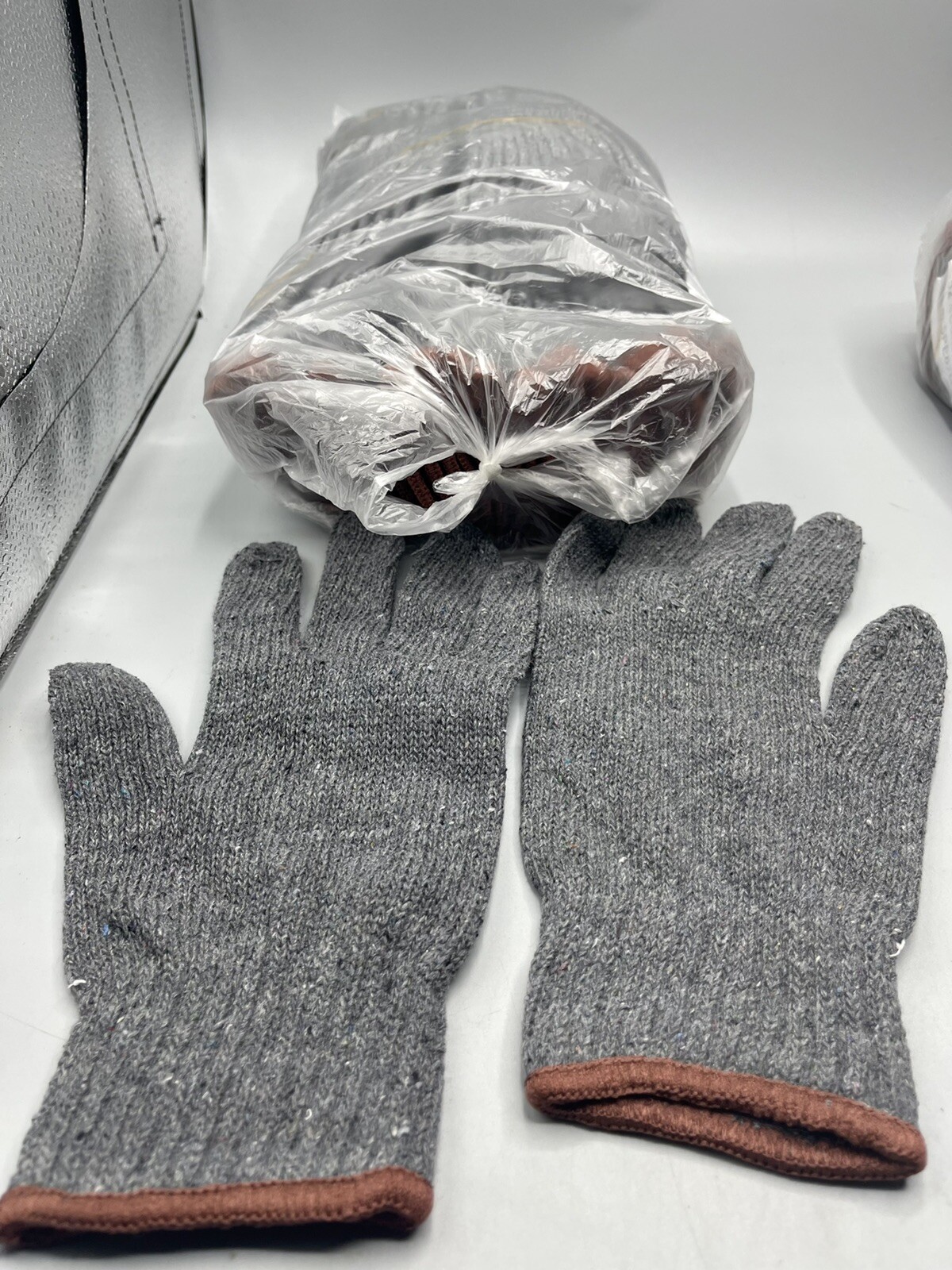 New in packaging 12 pack of Grainger mens gloves - size large.