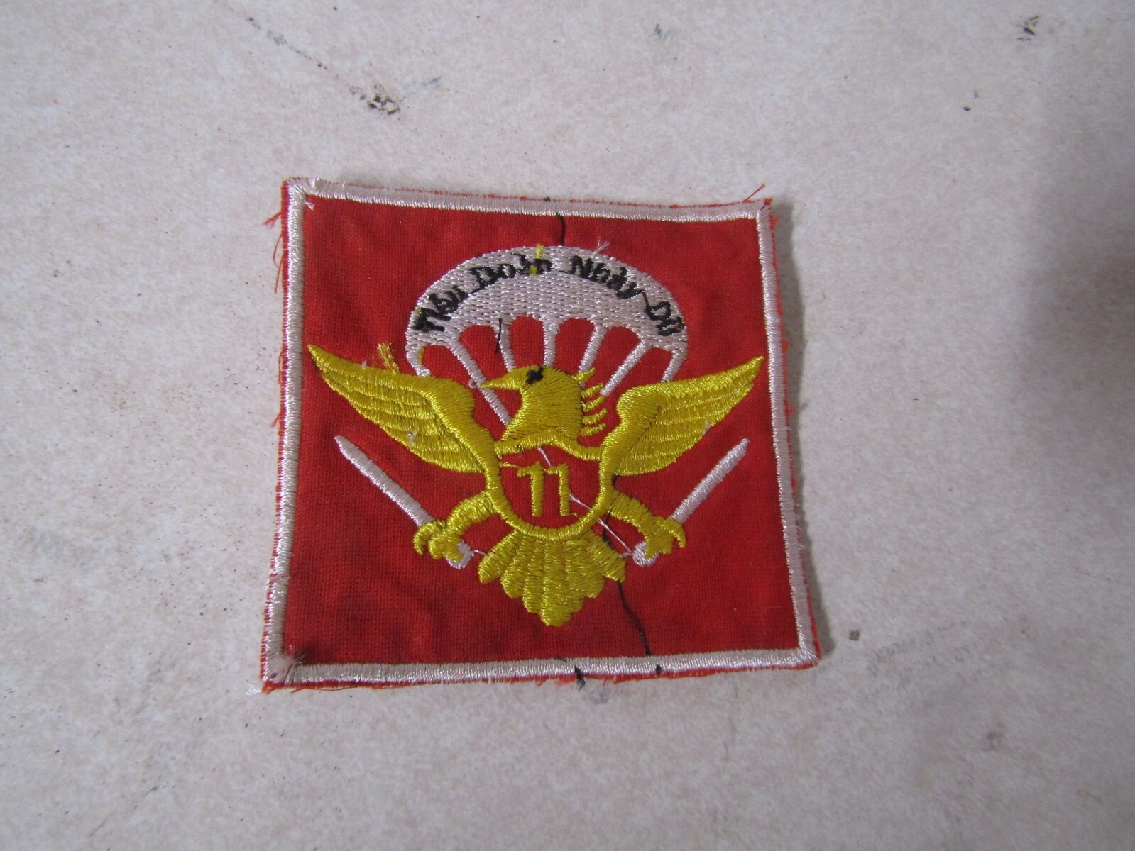 MILITARY PATCH OLDER VIETNAM ERA UNSURE OF THE WRITING 11 IN MIDDLE OF THE EAGLE