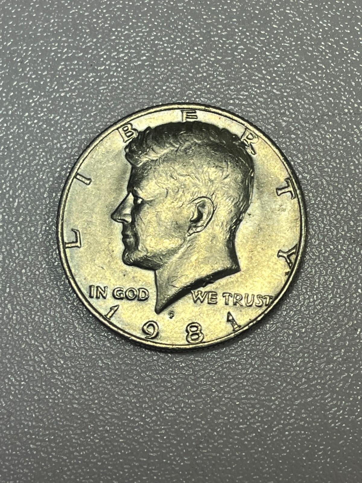 1981-P Clad Kennedy Almost Uncirculated to Uncirculated Half Dollar