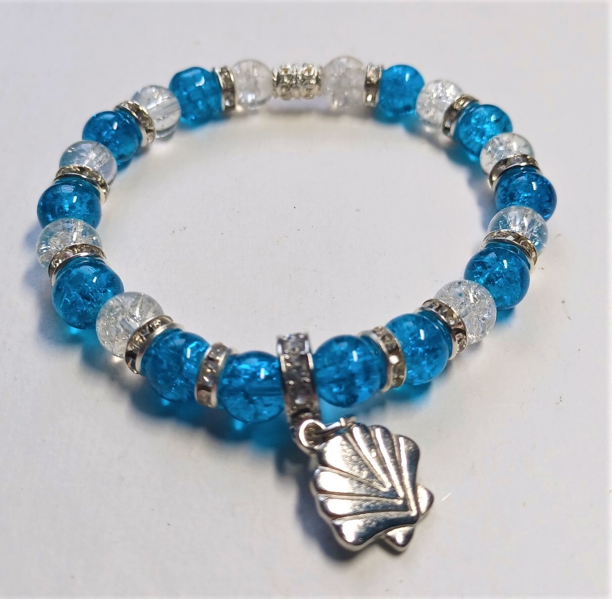 Blue And Clear Crackle Bracelet With Shell Charm