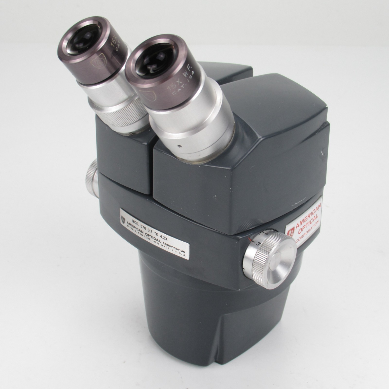AMERICAN OPTICAL AO 570 10.5X-63X(0.7x-4.2x) MICROSCOPE WITH 15X EYPEIECES
