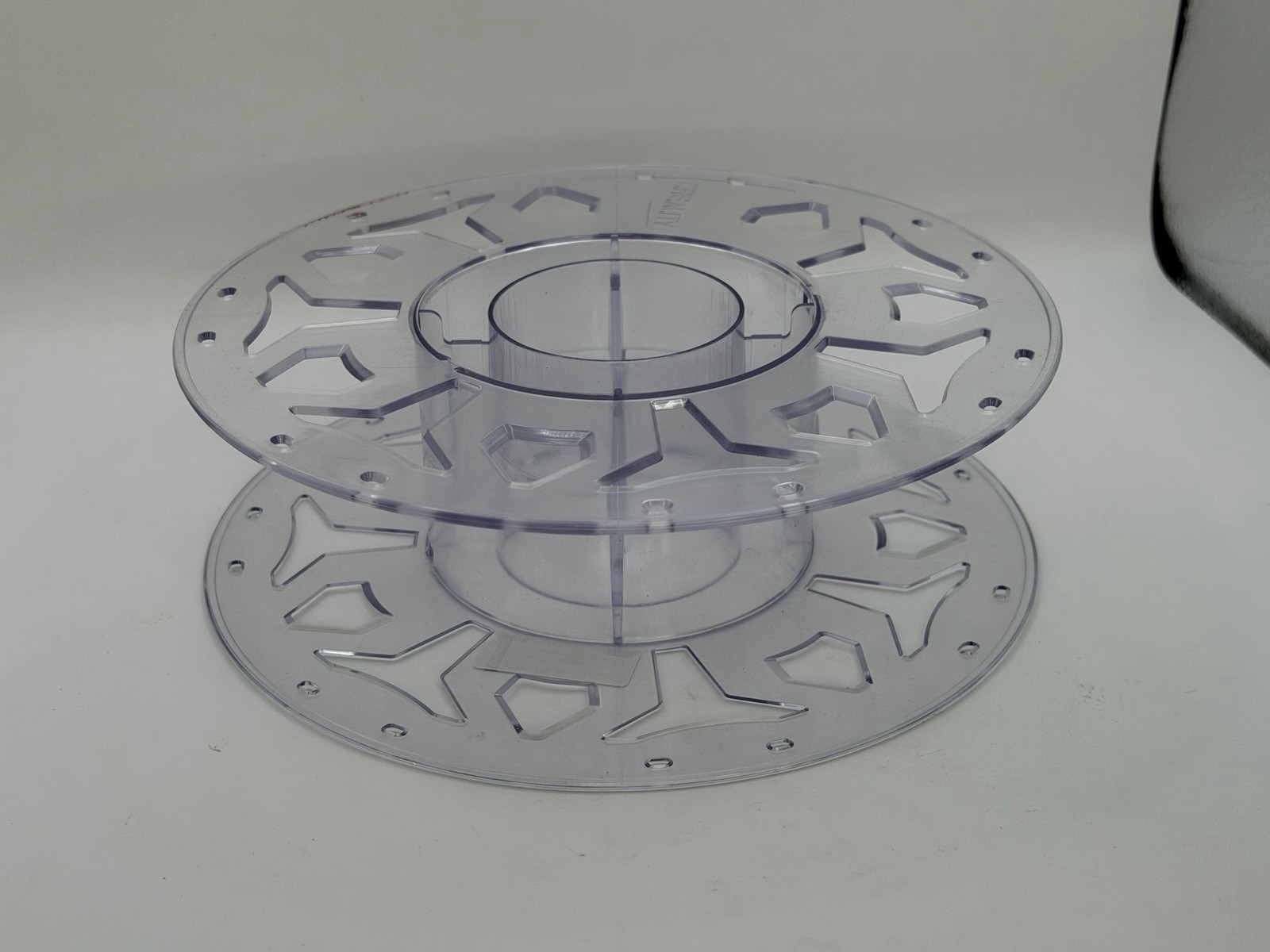 clear plastic filament spool