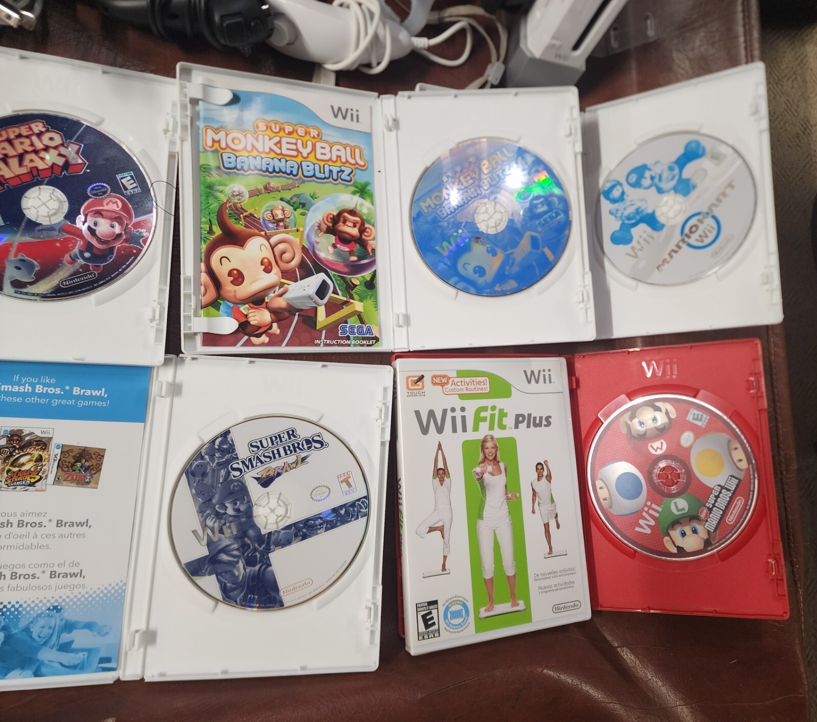 Wii Console plus, 9 games, 2 remotes, 1 nunchuck, System Plus Hookups & More