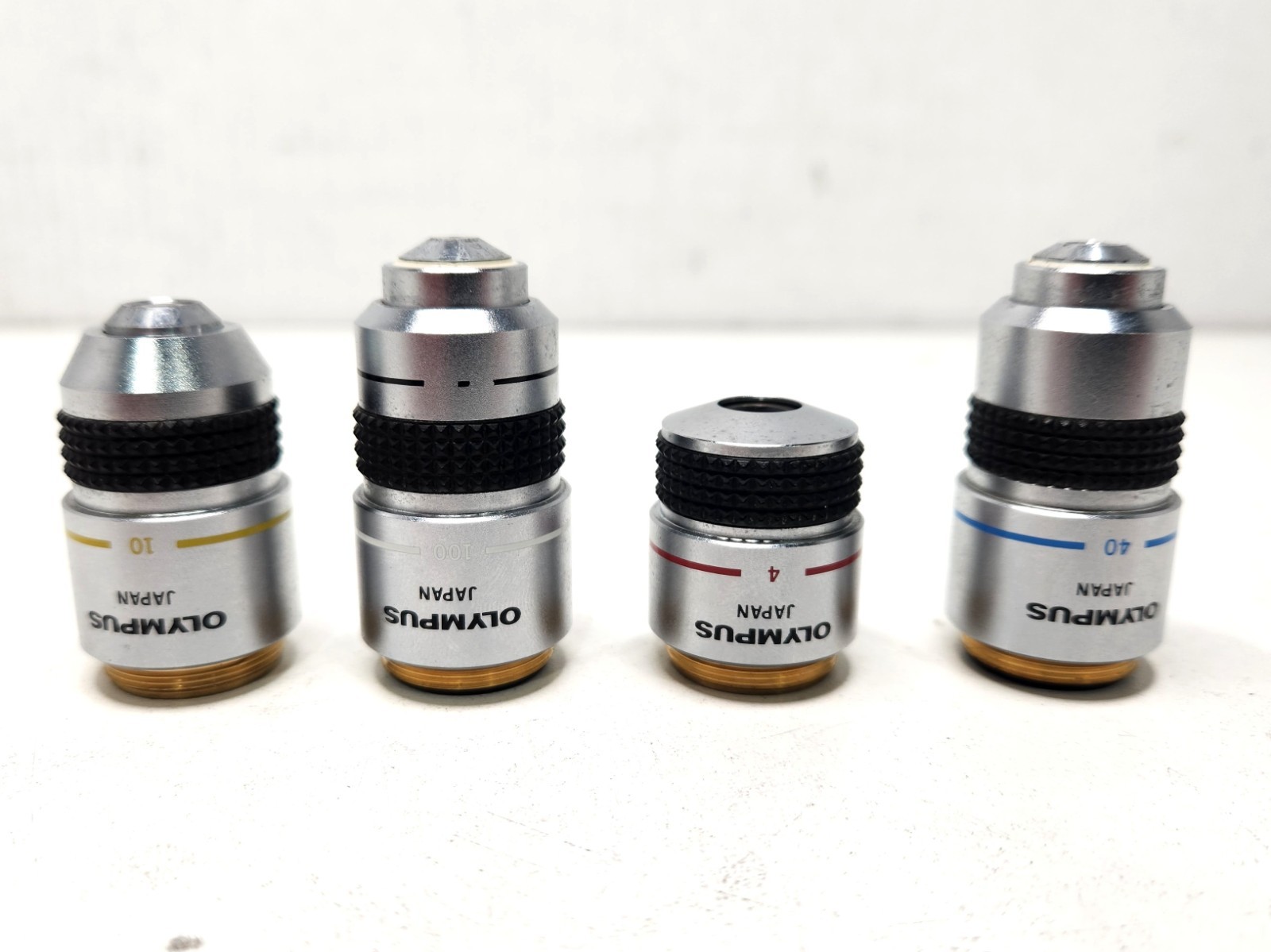 Mixed Lot of 4 Olympus Microscope Objectives A100/ A40/ A10/ A4