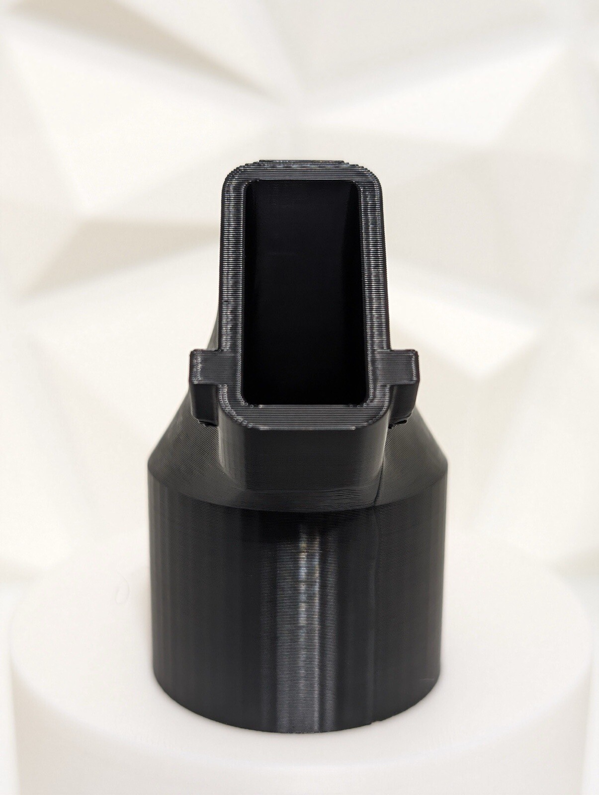 Adapter for DeWalt DW433 belt sander dust port to a common Shop-Vac 1-1/4" hose.