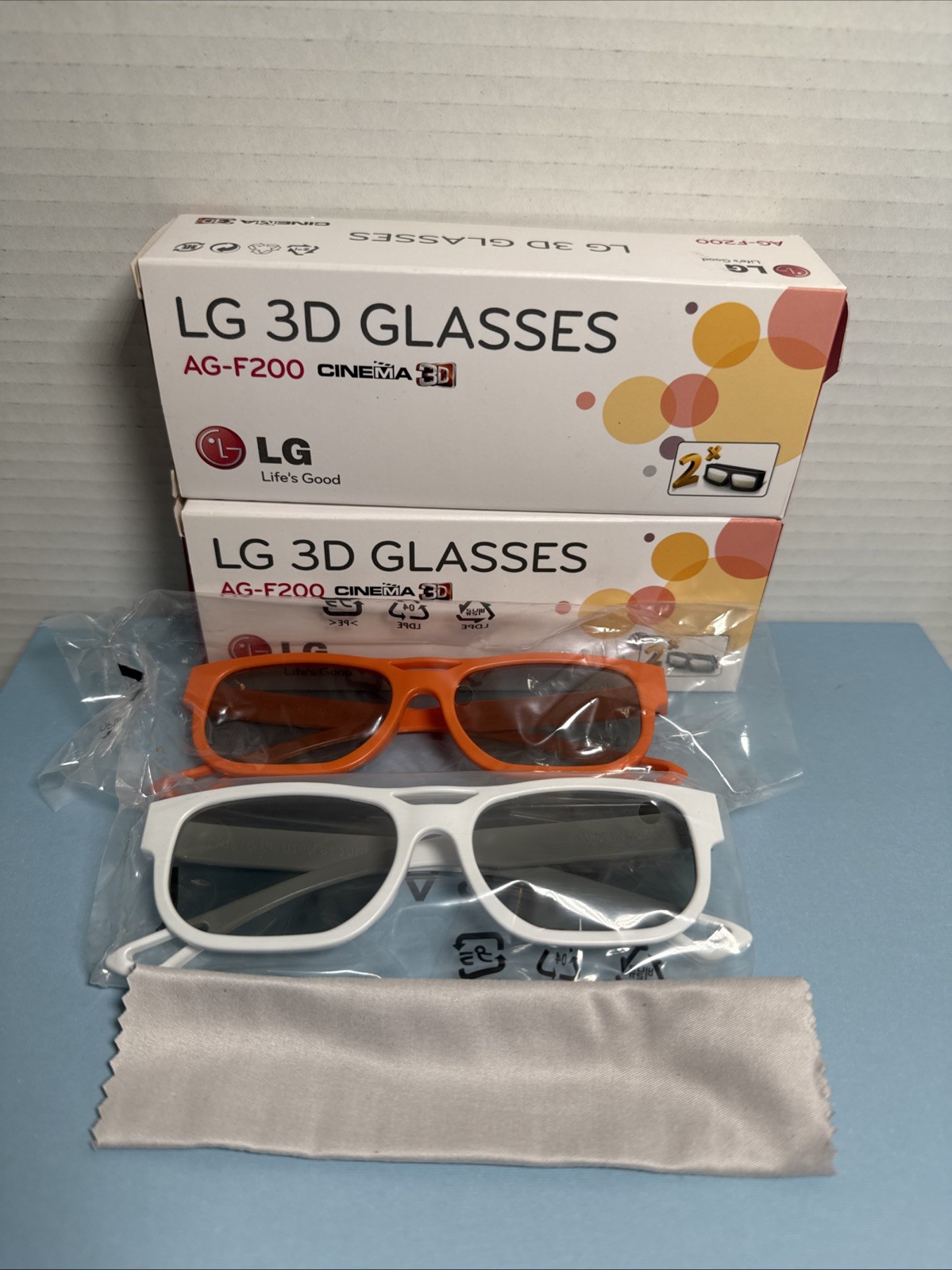 NEW LG 3D Glasses AG‑F200 Cinema | 2 BOXES (4 Pairs) Orange & White + 2 Cloths