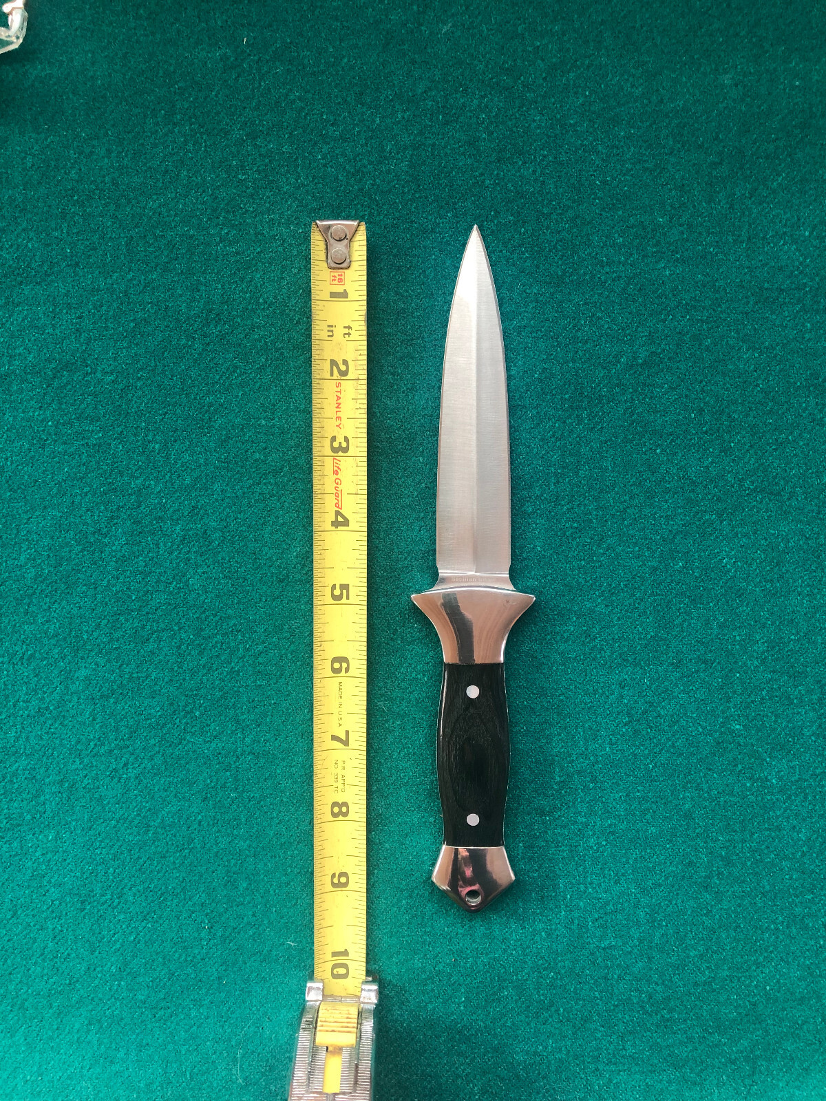 Dagger with black wooden handle