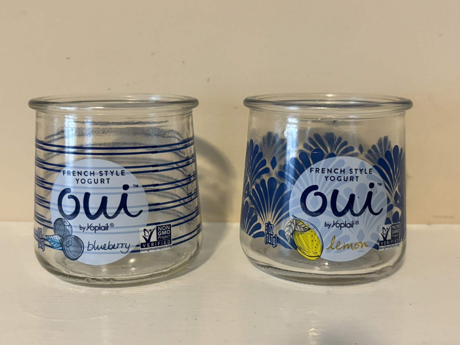 Two Yoplait Oui Yogurt Jars