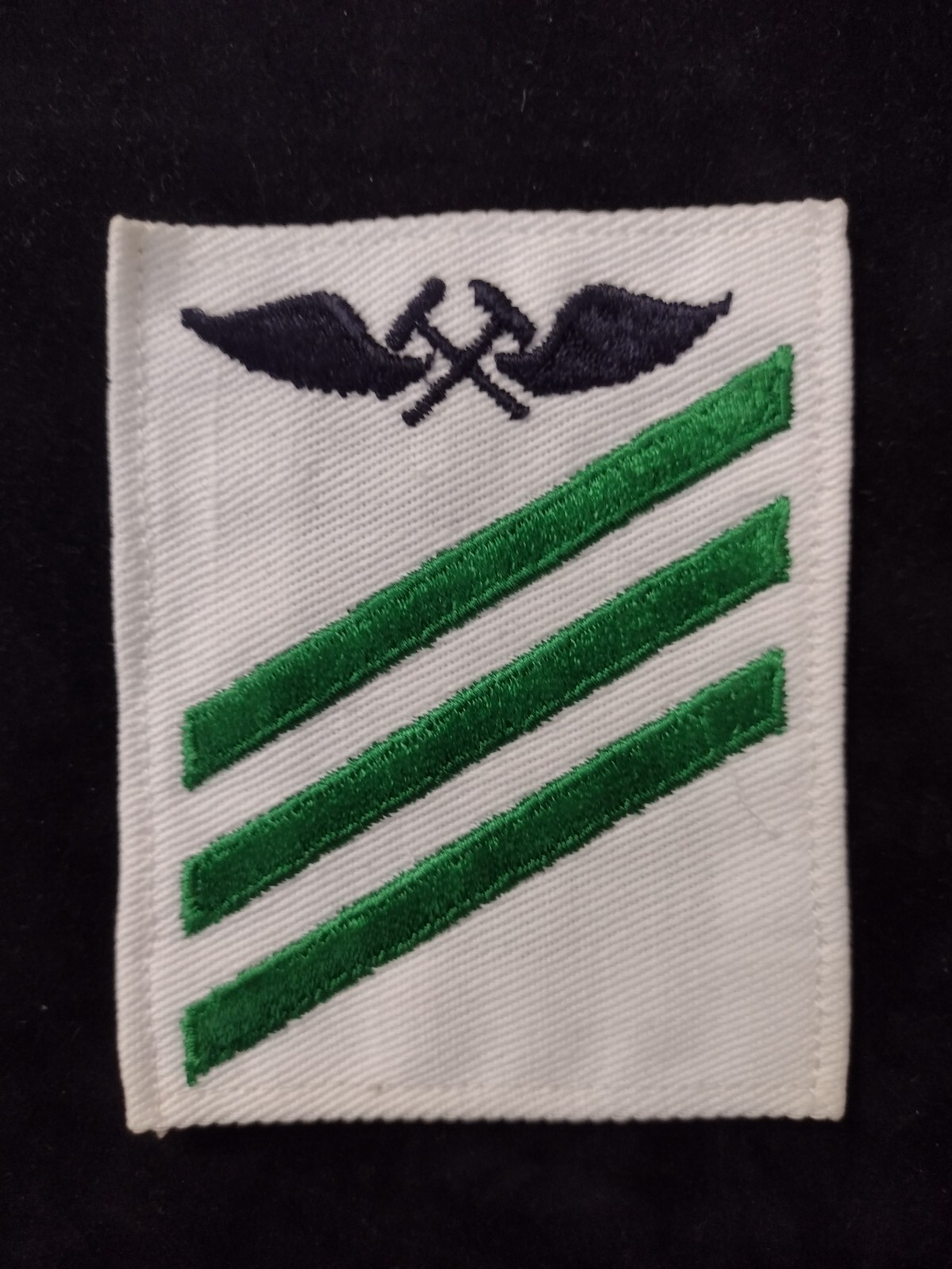 Navy Aviation Metalsmith (AM) E-3 Striker Rating Sleeve Insignia Green on White