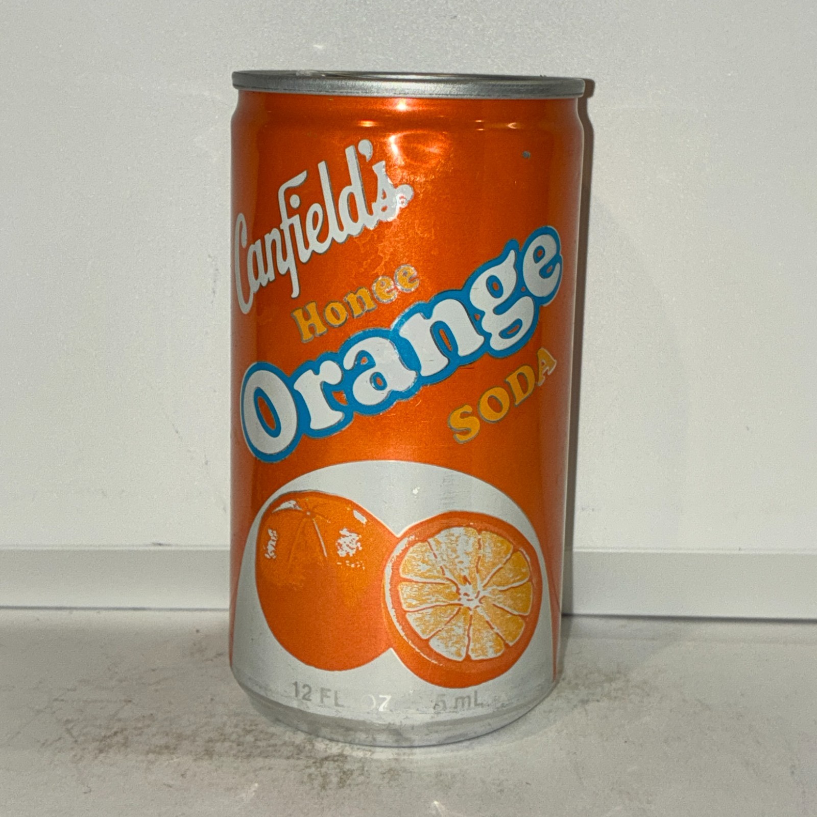 1970's Canfield's Honee Orange soda can, aluminum