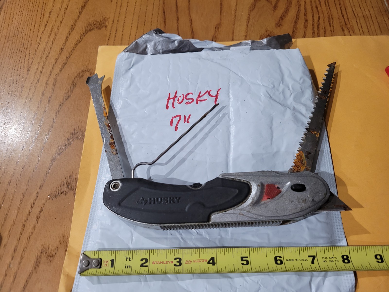 HUSKY 7" MULTI TOOL/KNIFE/ FISHING TOOL GOOD SHAPE
