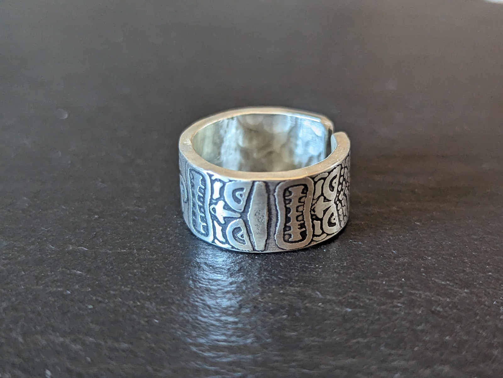 Thick sterling silver ring with tiki gods - handmade - open design