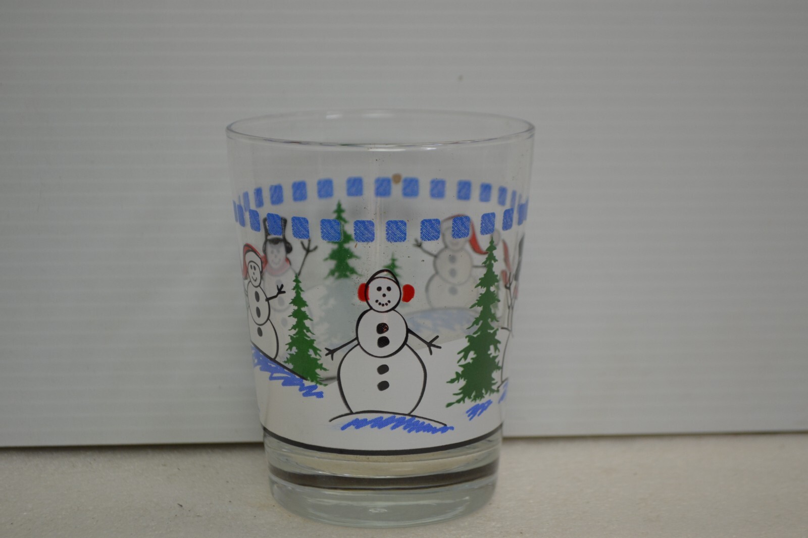 snow man drinking glass