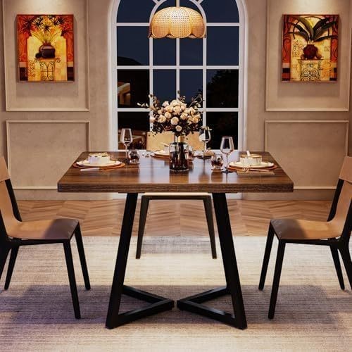 Dining table A brown industrial kitchen table with a black metal frame