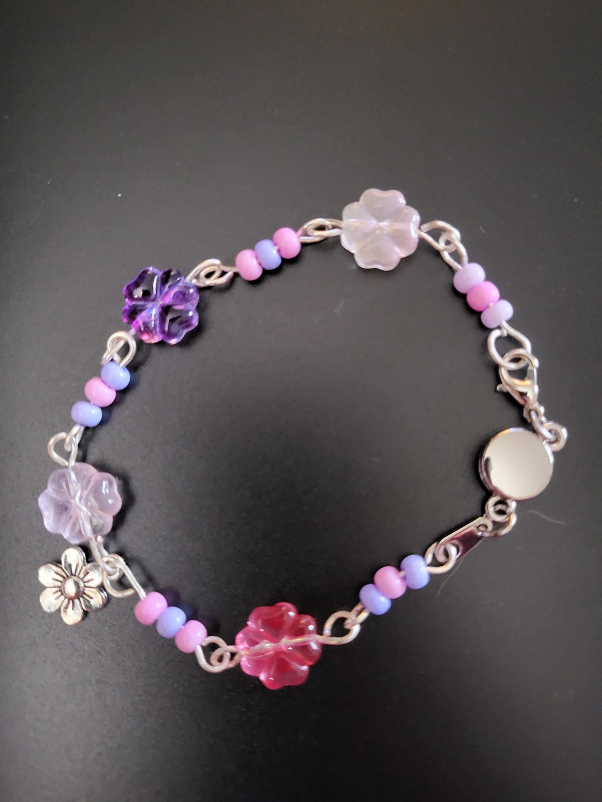 Handmade wired bracelet with beads and charm. 7 inches length, magnetic clasps