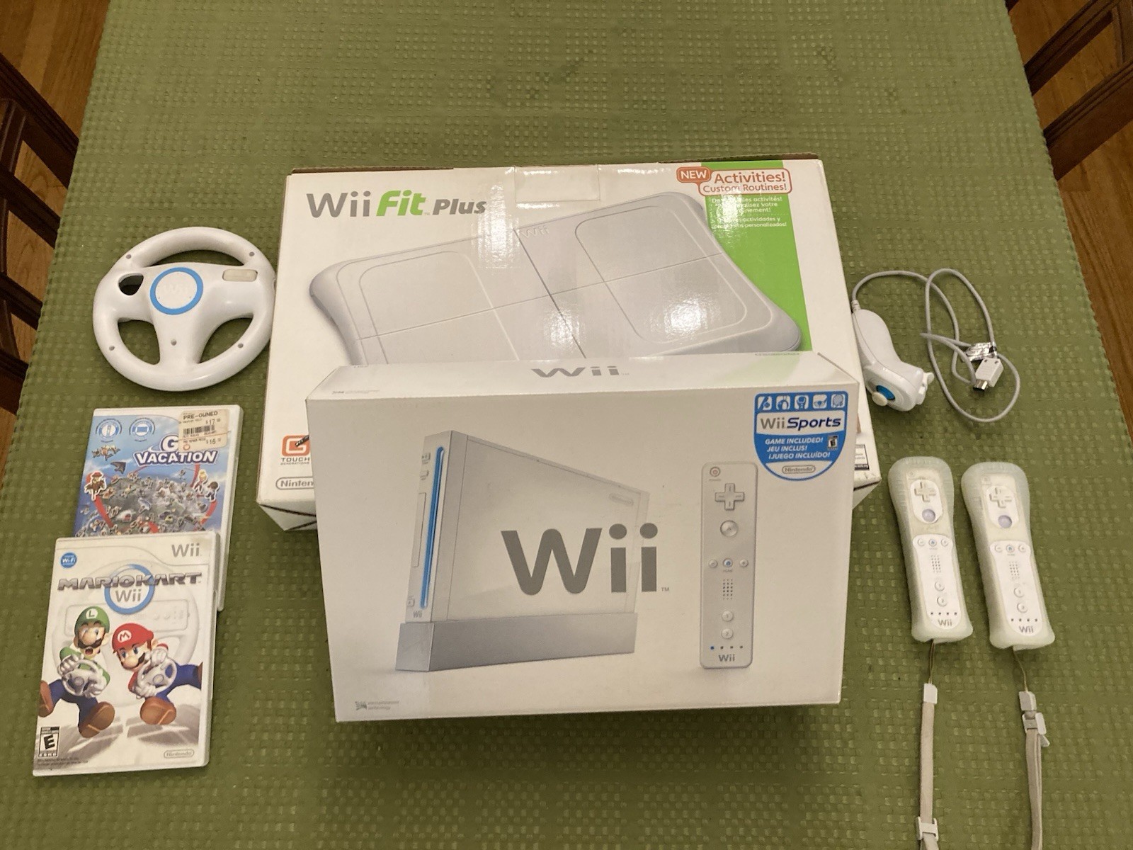 Nintendo Wii Bundle with Wii Fit Plus, Extra Accessories and Games