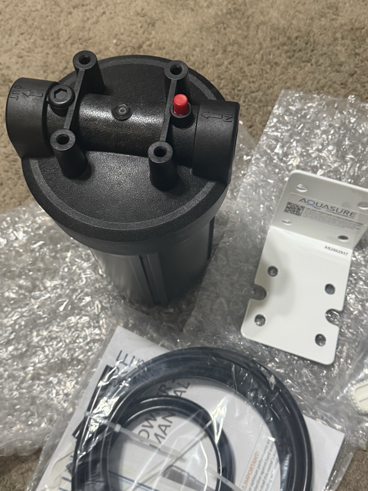 AQUASURE REPLACMENT FILTER CANSITER AND MOUNTING BRACKET AND HOSE TOOLS ETC.