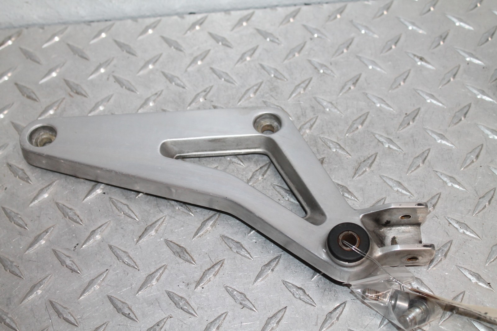 1985 HONDA  VF1100C LEFT REAR FOOTPEG PILLION MOUNT BRACKET 50690-MB4-000