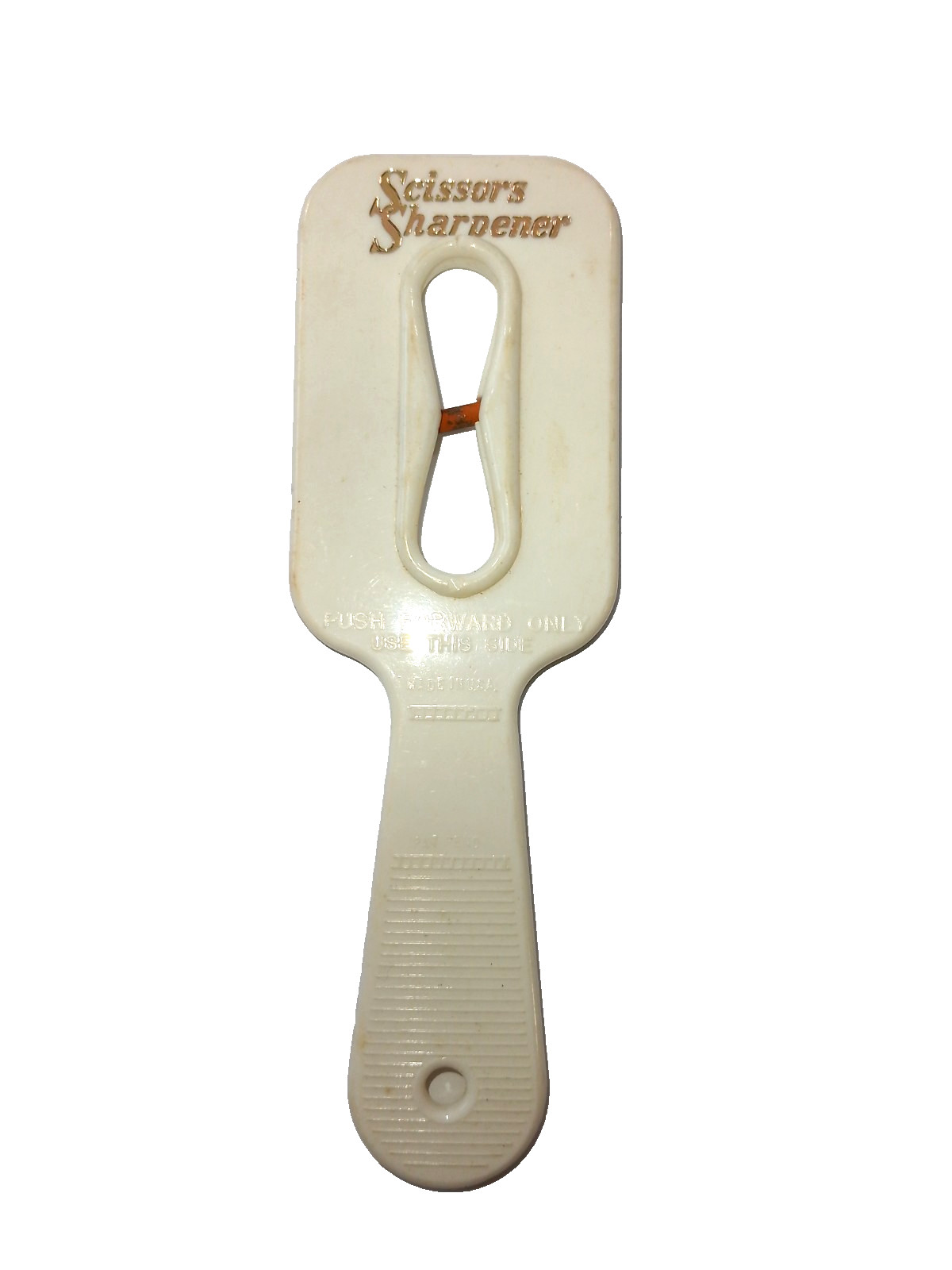 Vintage white scissors sharpener