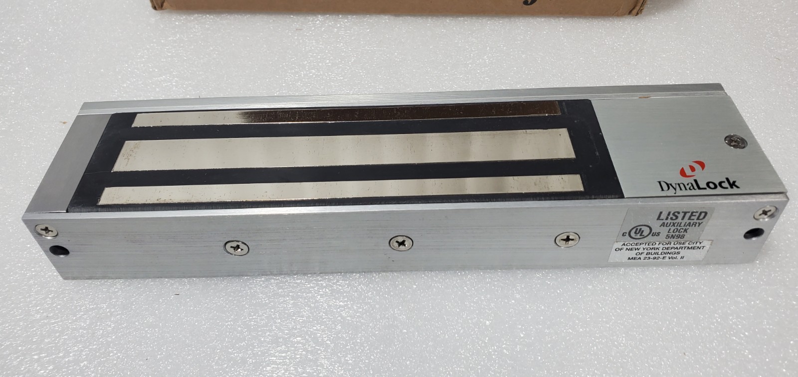 DynaLock 2011-US28-DSM Surface Mount Electromagnetic Lock 1200 LBS 12/24V NEW.